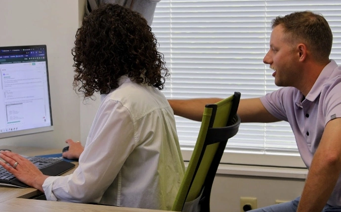 Consultants reviewing UX and landing page issues for conversion rate optimization consulting
