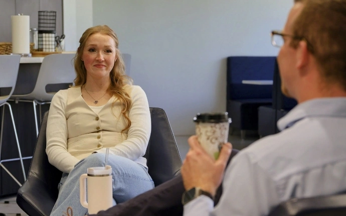 An OuterBox account manager and consultant meeting in the office to plan a monthly SEO services engagement.