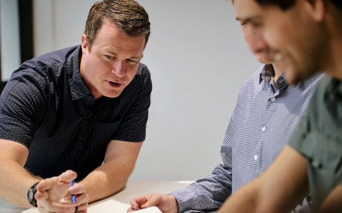 Two OuterBox PPC consultants in a strategy working session