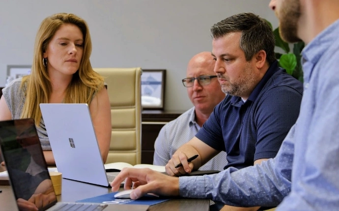 The Outerbox bigcommerce SEO experts at work on a computer