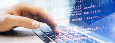 Hands typing on a keyboard with HTML markup overlay, the structured data behind small business SEO packages.