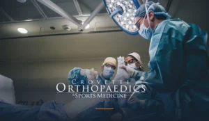 Crovetti Orthopaedics & Sports Medicine surgical team performing an orthopedic operation, with the practice's official wordmark