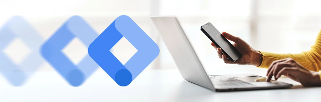 Google Tag Manager logo beside a laptop and phone for a guide to what GTM does for tracking