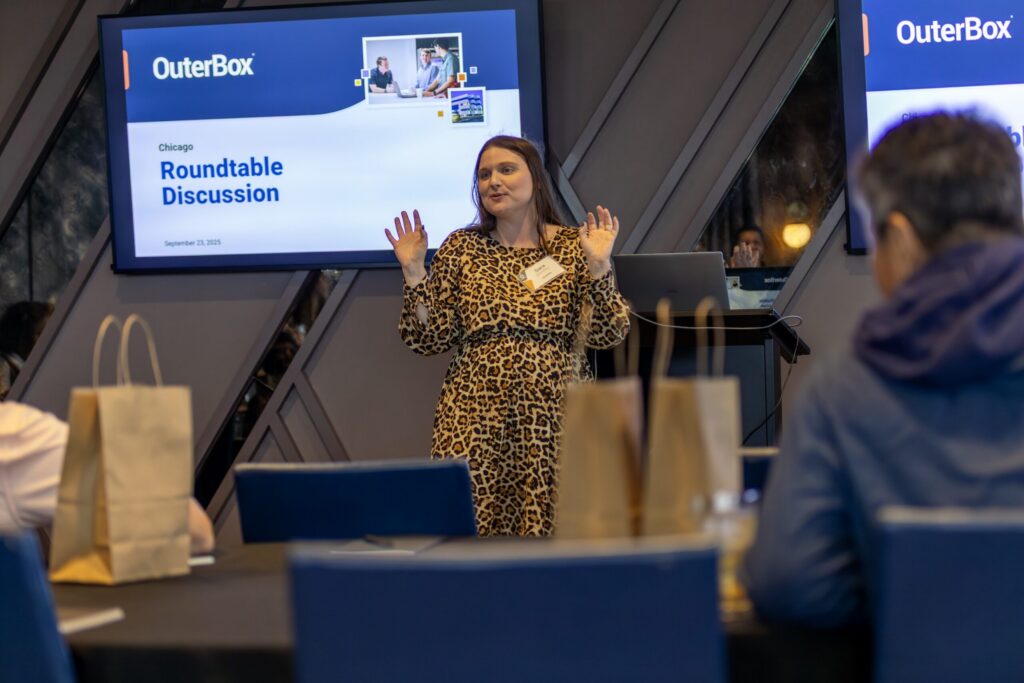 OuterBox presenter leading manufacturing marketing agency process discussion at a client roundtable.