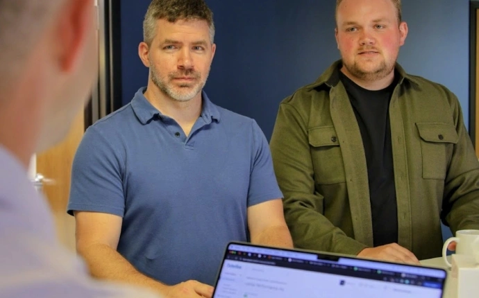 OuterBox specialists discussing ecommerce PPC performance marketing strategy