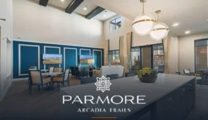 Parmore Arcadia Trails 55+ senior-living community clubhouse interior with open kitchen, dining and lounge space, overlaid with the community's official Parmore | Arcadia Trails wordmark