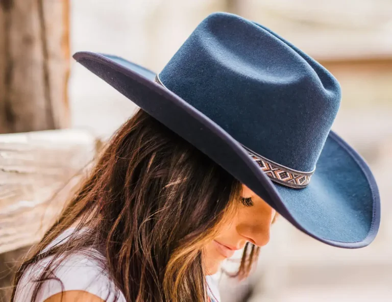 Woman wearing a navy cowboy hat from American Hat Makers