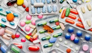 Assorted pharmaceutical tablets and capsules in blister packs
