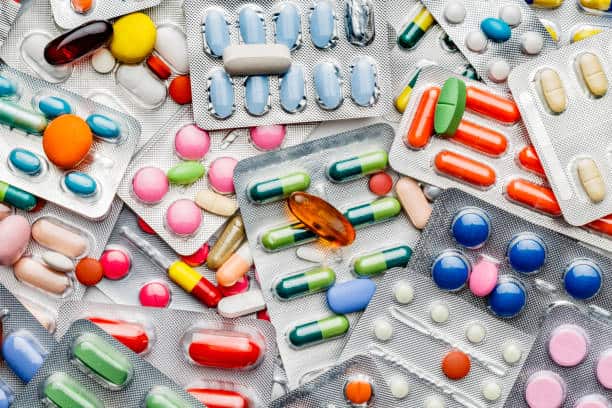 Assorted pharmaceutical tablets and capsules in blister packs