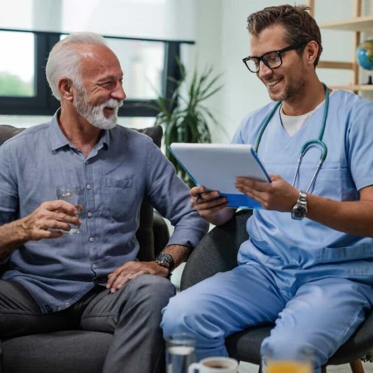 A clinician and a patient reviewing digitized medical records together on a tablet