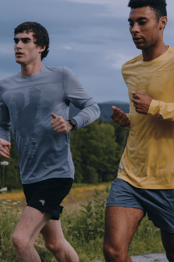 Two Tracksmith runners training outdoors