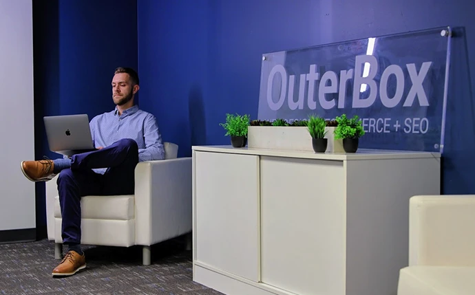 OuterBox strategist working on a telehealth marketing engagement plan in the agency office