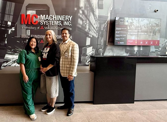 OuterBox team in the Machinery Systems showroom